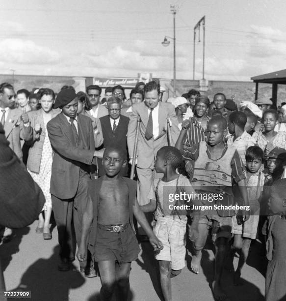Newspaper editor and son of Mahatma Gandhi, Manilal Gandhi and Patrick Duncan lead a procession into Germiston in the Gauteng province of South...