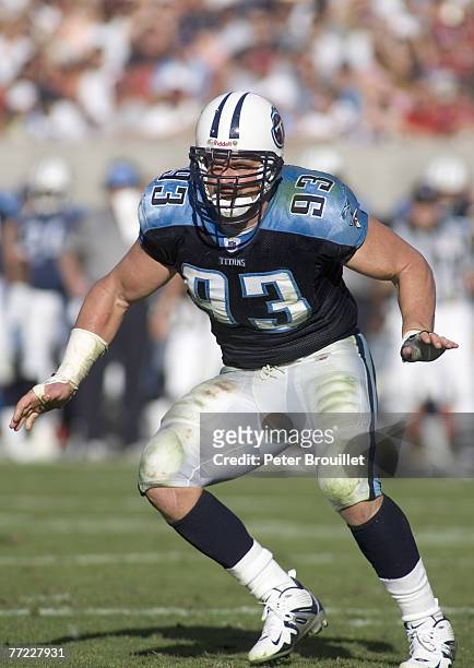 Kyle Vanden Bosch defensive end for the Tennessee Titans guards against the run in a game against the Arizona Cardinals at Sun Devil Stadium in...