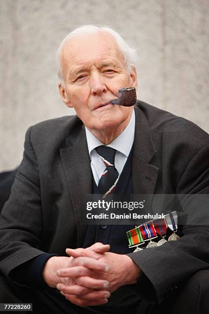 Former Labour MP Tony Benn smokes a pipe during an Anti-War rally on October 8, 2007 in London, England. Anti-war protesters marched down Whitehall...