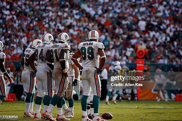 The defense for the Miami Dolphins stands on the field during the game against the Dallas Cowboys of at Dolphins Stadium on September 16, 2007 in...