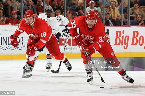 Kris Draper and Kirk Maltby of the Detroit Red Wings skate on ice together during the game between the Edmonton Oilers and Detroit Red Wings on...