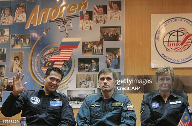 Members of an International space crew Sheikh Muszaphar Shukor of Malaysia, Yury Malenchenko of Russia and Peggy Whitson of the United States attend...