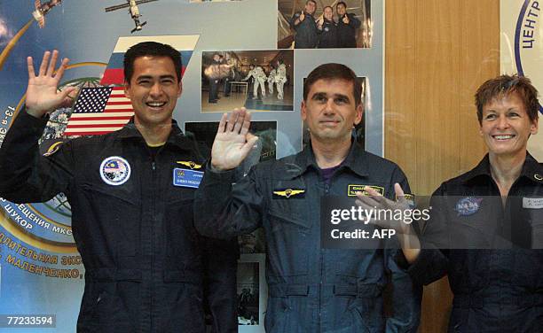 Members of an International space crew Sheikh Muszaphar Shukor of Malaysia, Yury Malenchenko of Russia and Peggy Whitson of the United States pose...