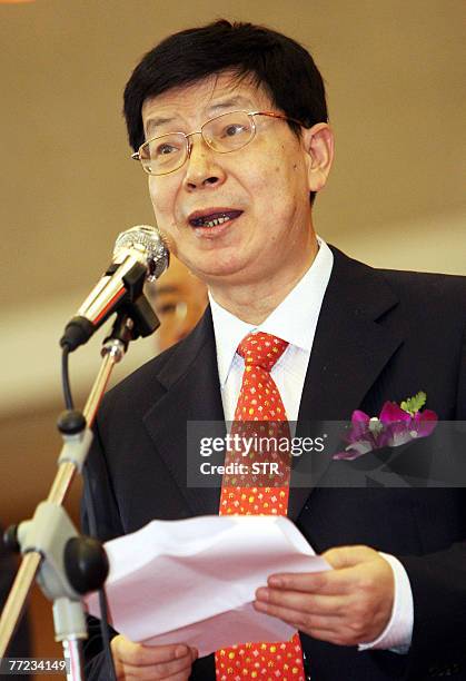 China Shenhua Energy Chairman Chen Biting is seen during a press conference after the company's trading debut at the Shanghai Stock exchange in...