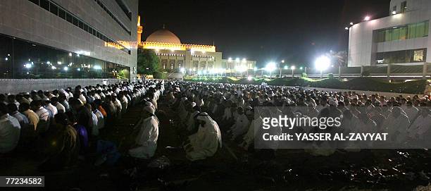 Muslim men pray in Kuwait City's Grand Mosque just before daybreak, early 09 October 2007, during Laylat al-Qadr, which falls on the 27th day of the...