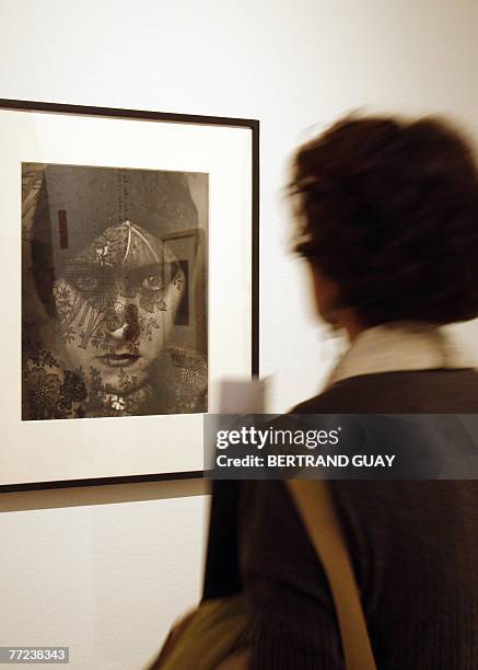 Visitor looks at a photograph taken in 1924 of US actrees Gloria Swanson during an exhibition dedicated to US fashion photographer, war reporter and...