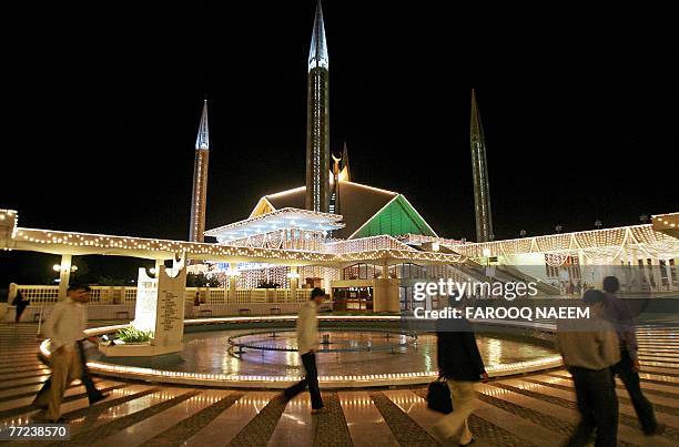 Pakistani Muslim men arrive at the Faisal Mosque in Islamabad, 09 October 2007, on the occasion of the Laylat Al-Qadr Festival. Laylat al-Qadr is the...