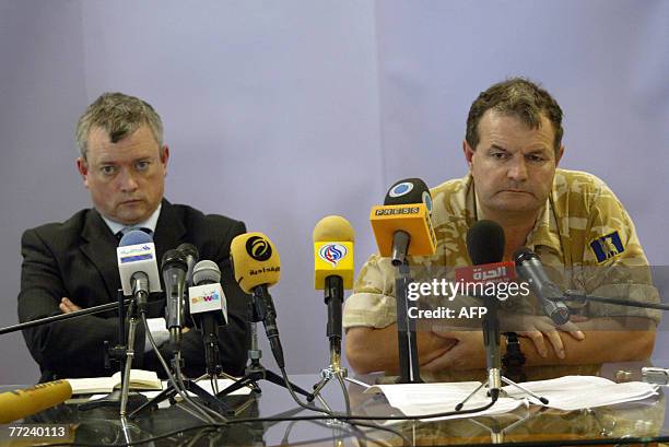 British Consul Richard John and Commander Major General Graham Binns listen to a question during a press conference in Basra, 09 October 2007....