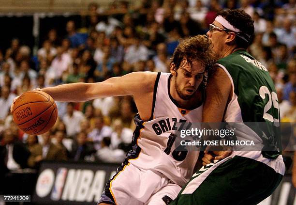 Memnphis Grizzlies' Pau Gasol vies with Unicaja's Daniel Santiago during their Basketball match at Martin Carpena Stadium in Malaga, southern Spain,...