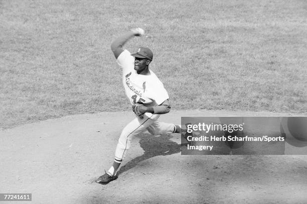 Bob Gibson of the St. Louis Cardinals pitching during Game 7 of the 1964 World Series against the New York Yankees on October 15, 1964 in St. Louis,...