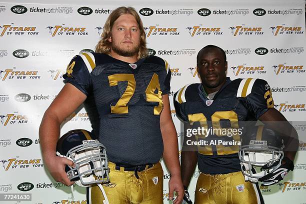 Running Back Leon Washington and Center Nick Mangold of the New York Jets sport the team's Throwback uniform of the New York Titans for a press...