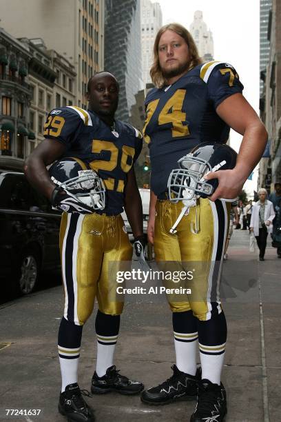 Running Back Leon Washington and Center Nick Mangold of the New York Jets sport the team's Throwback uniform of the New York Titans for a press...