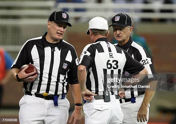 Referee Bill Carollo listens to call during the game between the Detroit Lions and the Chicago Bears on September 30, 2007 at Ford Field in Detroit,...