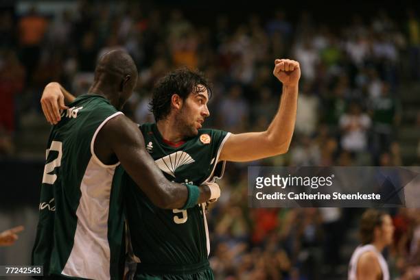 Berni Rodriguez and Boniface N'Dong of the Unicaja are celebrating the win over the Memphis Grizzlies after the game during the EA Sports NBA Europe...