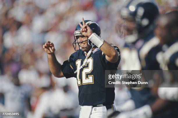 Stan Humphries, Quarterback for the San Diego Chargers calls a play from the instructions on his left forearm during the American Football Conference...