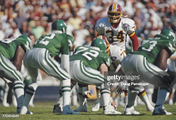 Martin Bayless, Strong Safety for the Washington Redskins stares down Quarterback Randall Cunningham and the Philadelphia Eagles offensive line...