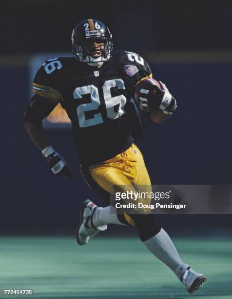 Rod Woodson, Defensive Back for the Pittsburgh Steelers runs the ball during the American Football Conference Central game against the Cincinnati...