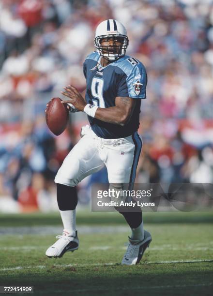 Steve McNair, Quarterback for the Tennessee Titans runs the ball during the American Football Conference Central game against the Pittsburgh Steelers...