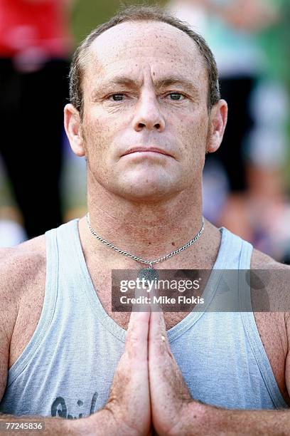 Former professional surfer Tom Carroll takes part in the 2007 Yoga Aid Challenge at the Sydney Botanical Gardens on October 10, 2007 in Sydney,...