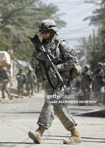 Soldier from Alpha Company of 1/38 Infantry Regiment patrols downtown Baquba, 10 October 2007, some 50 kilometres northeast of Baghdad. As Ramadan...