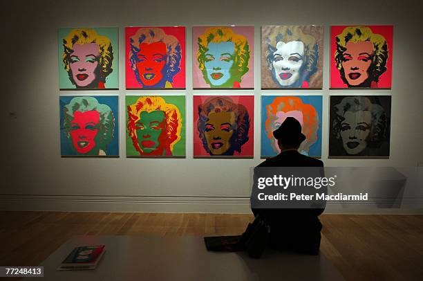 Visitor to the Pop Art Portraits exhibition at National Portrait Gallery looks at Andy Warhol's 'Marilyn Monroe 1967' on October 10, 2007 in London....