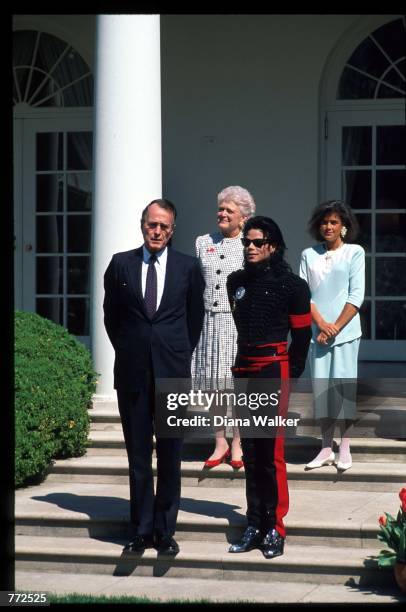 Entertainer Michael Jackson stands with President George Bush April 5, 1990 at the White House. Jackson, who was the lead singer for the Jackson Five...