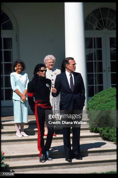 Entertainer Michael Jackson stands with President George Bush April 5, 1990 at the White House. Jackson, who was the lead singer for the Jackson Five...