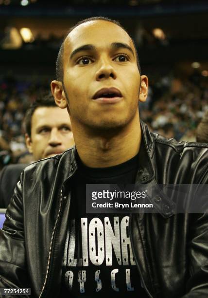 British Formula One driver, Lewis Hamilton watches the action during NBA Europe Live 2007 Tour match between the Boston Celtics and the Minnesota...