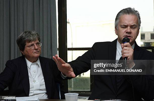 Actor and movie director Tim Robbins gestures while Sister Helen Prejean a prison minister and author of "Dead Man Walking: An Eyewitness Account of...