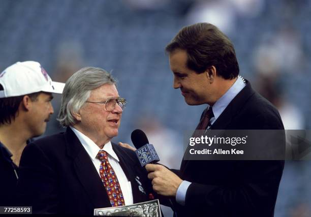 Tennessee Titans owner K.S. "Bud" Adams, Jr. Holds the Lamar Hunt Trophy and talks with Jim Nance on the podium following the Titans 33-14 victory...