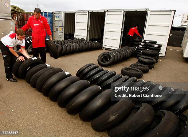 Bridgestone tyre technicians prepare tyres in the pit paddock ahead of the Australian Motorcycle Grand Prix at the Phillip Island Circuit on October...