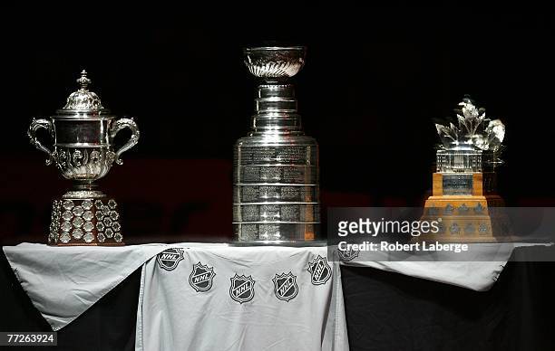 The Stanley Cup is placed between the Clarence Campbell Trophy and the Conn Smythe Trophy during a pre-game ceremony honoring the Anaheim Ducks...