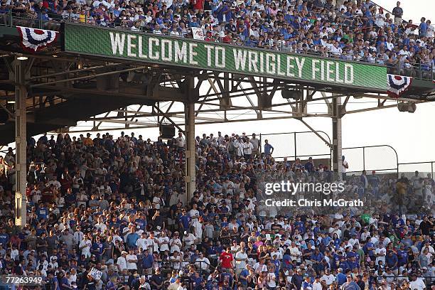 General view of fans as they sit in the stands waiting for the start of Game Three of the National League Divisional Series between the Chicago Cubs...