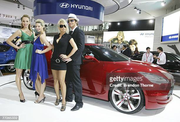 Models pose with the Hyundai Veloster Concept at the 2007 Australian International Motor Show at the Sydney Convention and Exhibition Centre on...