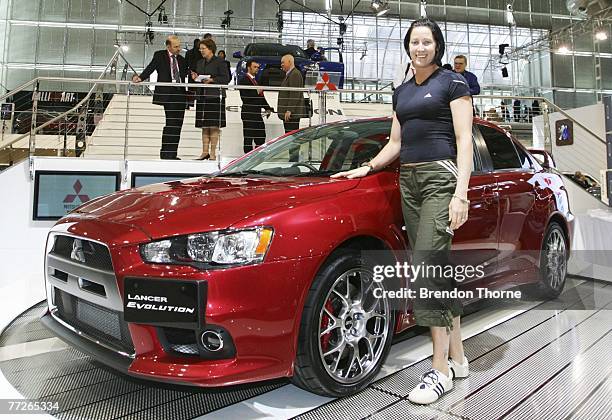 Jana Rawlinson poses with the new Mitsubishi Evo X at the 2007 Australian International Motor Show at the Sydney Convention and Exhibition Centre on...