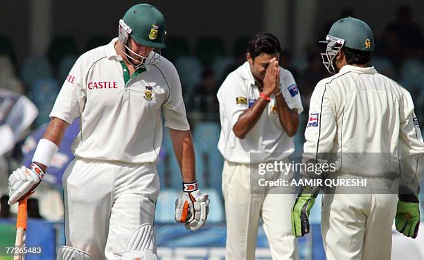 Pakistani cricketer Danish Kaneria reacts after taking the wicket of South African cricket captain Graeme Smith during the fourth day of the second...