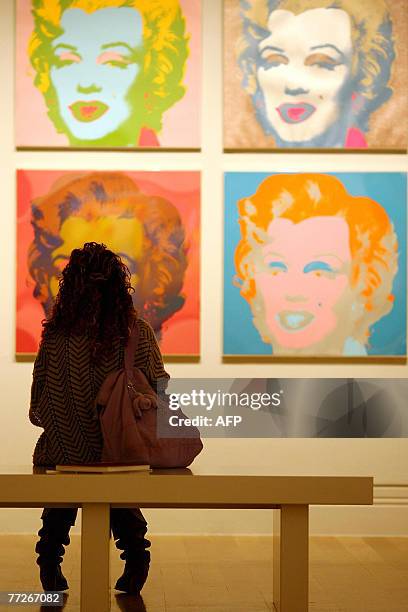Visitor examines Andy Warhol's Marilyn Monroe 'Marilyn 1967' at the Pop Art Portraits exhibition, National Portrait Gallery in central London, 11...