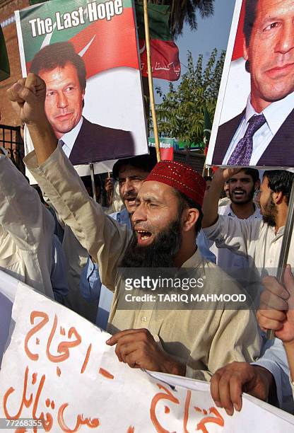 Activists of Pakistan Tehreek-e-Insaf party stage a protest against the military operation in the tribal area of North Waziristan, in Peshawar, 11...