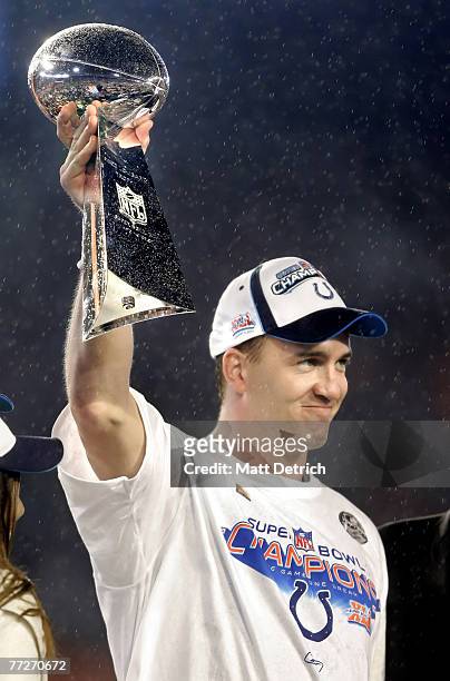 Colts quarterback and MVP Peyton Manning hoists the Vince Lombardi trophy in the air after the Colts defeated the Chicago Bears during Super XLI at...