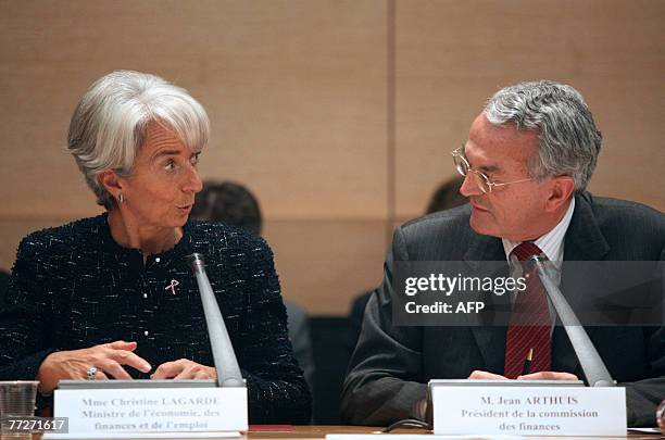 French Economy minister Christine Lagarde chats with Senate Financial commission president Jean Arthuis, 11 October 2007 in Paris, as she is listened...