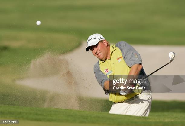 John Daly hits out of a bunker during the first round of the Frys.com Open benefiting Shriners Hospitals for Children at TPC Canyons on October 11,...