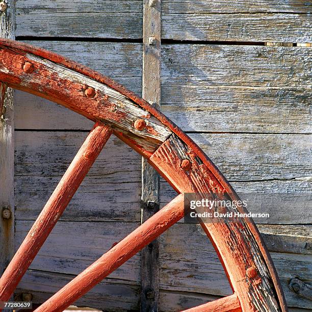 detail of the worn wheel of a cart - wooden cart wheels stock pictures, royalty-free photos & images