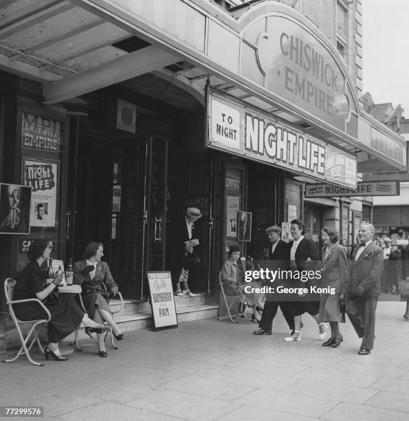 John Langridge and his wife arrive at the Chiswick Empire with their friends Matilda Ball and Bert Osborne, for a showing of 'Night Life', 17th July...