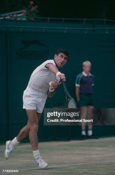 Australian tennis player Ken Rosewall pictured in action during competition in the seniors tennis tournament at the Wimbledon Lawn Tennis...