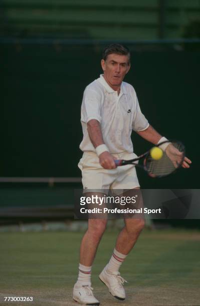 Australian tennis player Ken Rosewall pictured in action during competition in the seniors tennis tournament at the Wimbledon Lawn Tennis...