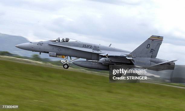 Hornet fighter jet lands at Clark international airport in Angeles, a former US military airbase 12 October 2007 to participate in the joint...