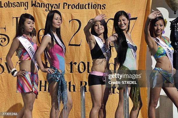 Participants of the Miss Tibet 2007 beauty pageant pose during the swimsuit competition in Dharamsala, 12 October 2007. The final of the event...