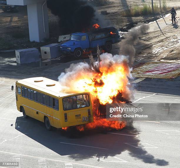 Fuel tanker explodes in a simulated crash with a coach during a public emergency drill held by emergency services at Yitonghe Metro Railway Station...