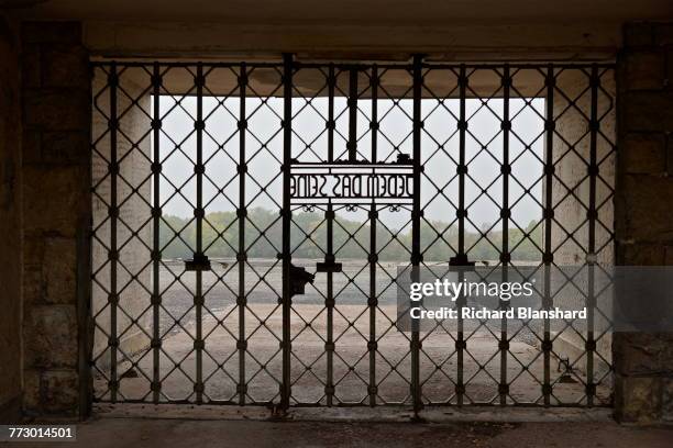 The main entrance gate to the Buchenwald German Nazi concentration camp near Weimar, Germany, 2014. Within the metalwork of the gate is the motto,...