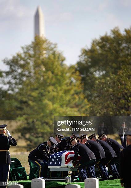 Soldiers from the US 3rd Infantry, traditionally known as the Old Guard, carry the remains of 12 US army soldiers, killed when their UH-60 Black Hawk...